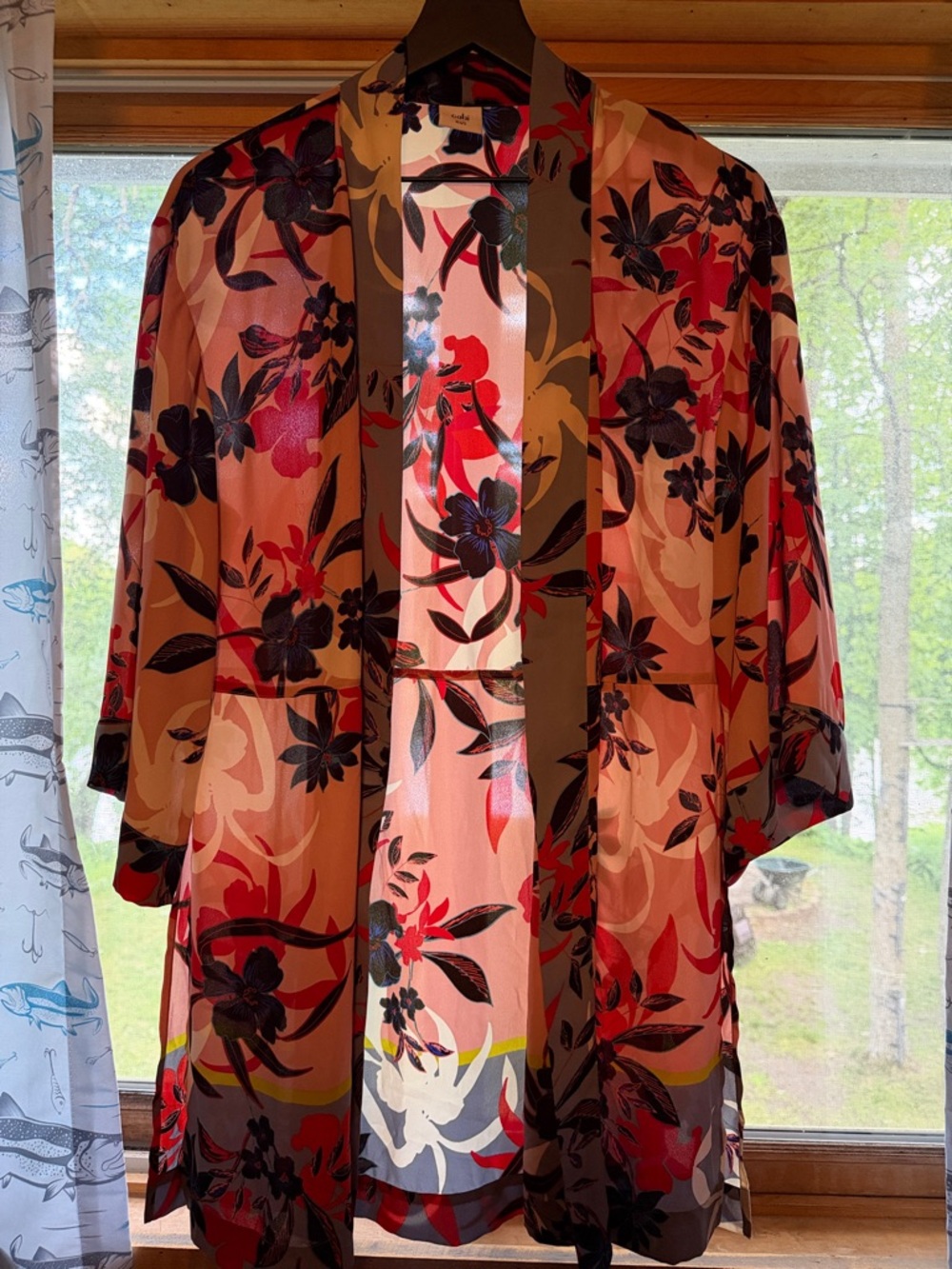 CAbi floral kimono cardigan features a sheer, pink-based fabric floral patterns